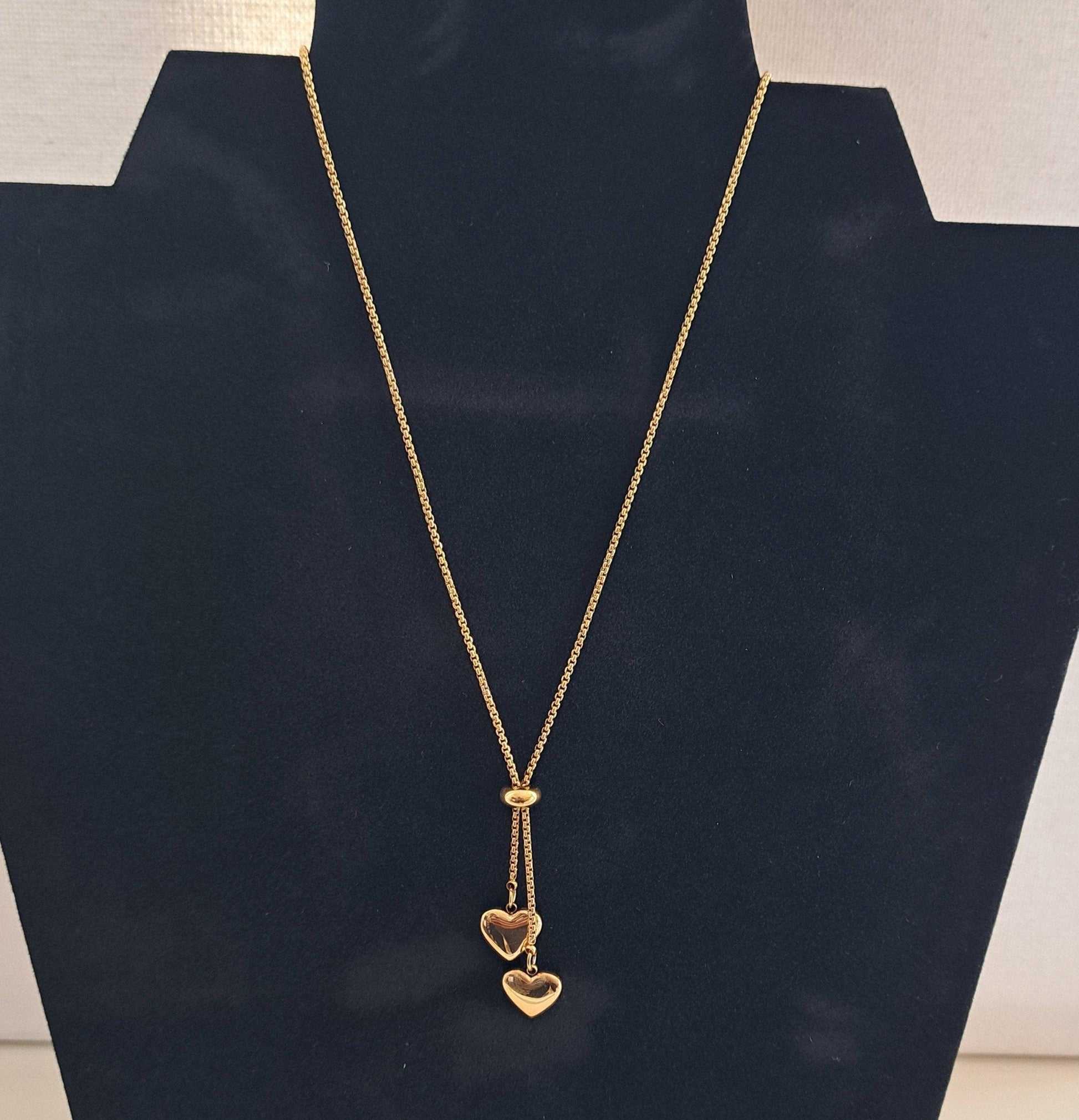 gold chain with two pendant