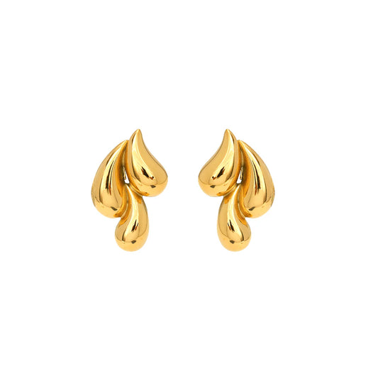 Pair of gold earrings on a white background. | gbaje jewelry