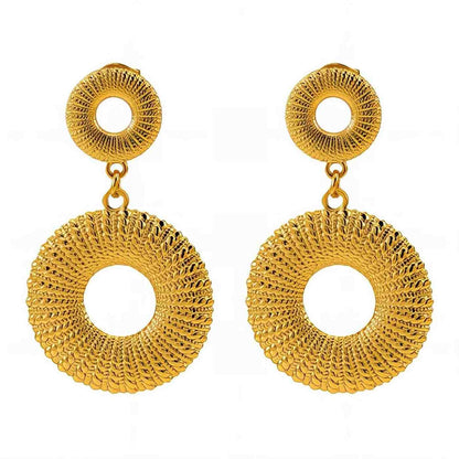 Pair of gold hoop earrings on a white background